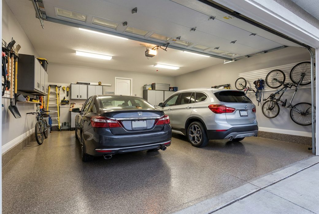 Two car garage before and after an epoxy floor coating
