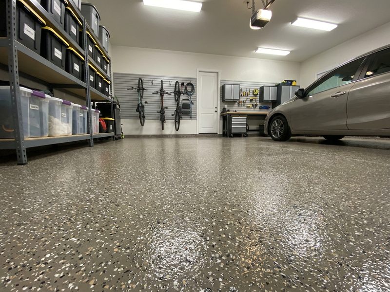 Residential garage floor finished with gray flake epoxy